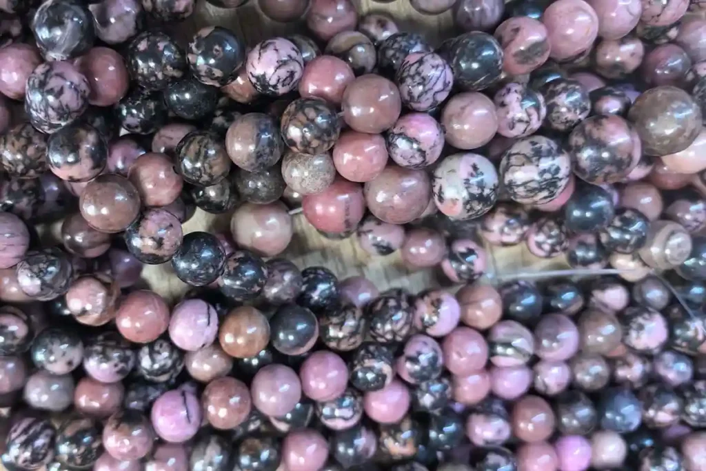 black line rhodonite strand beads for rhodonite vs rhodochrosite guide