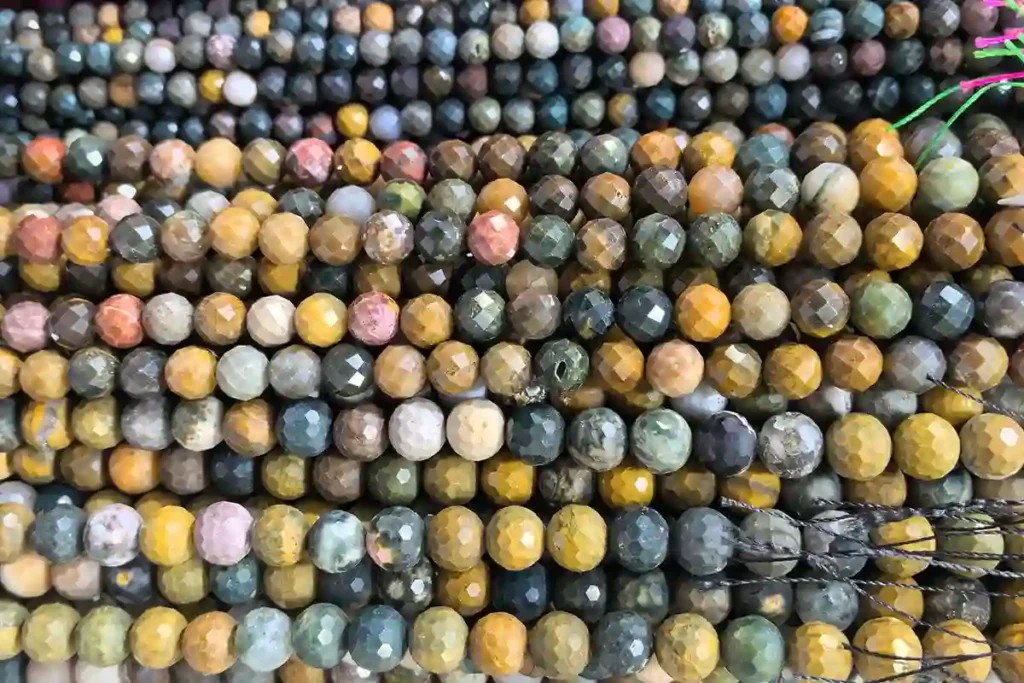Ocean Jasper Meaning shown through faceted Ocean Jasper beads with natural patterns