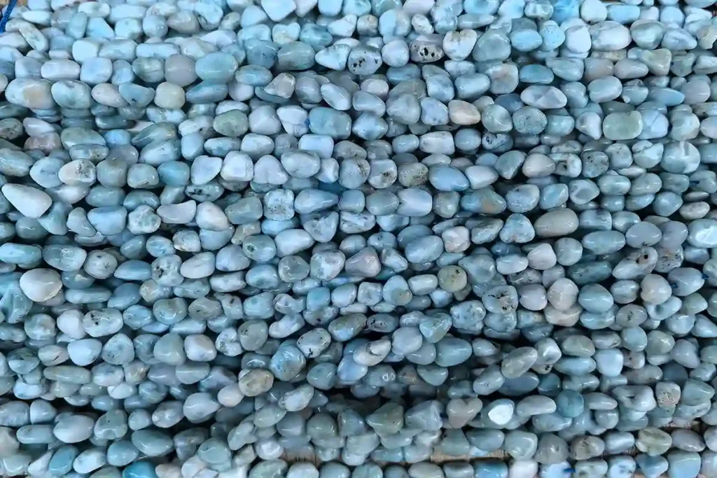 Irregular Larimar gemstone beads reflecting Larimar Stone Benefits with natural ocean-blue texture