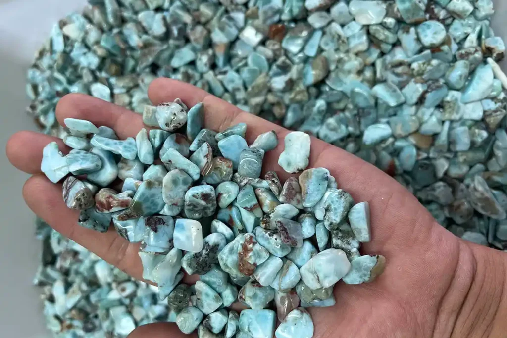 Larimar Stone Benefits shown through natural Larimar chip stones displayed in hand