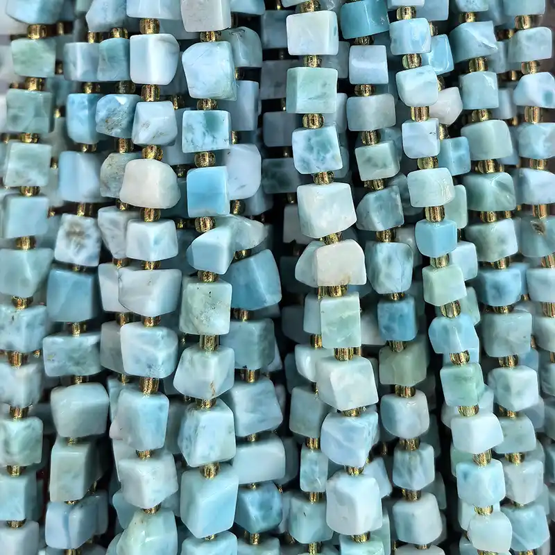 Irregular cube Larimar strand beads highlighting Larimar Stone Benefits and natural blue stone patterns