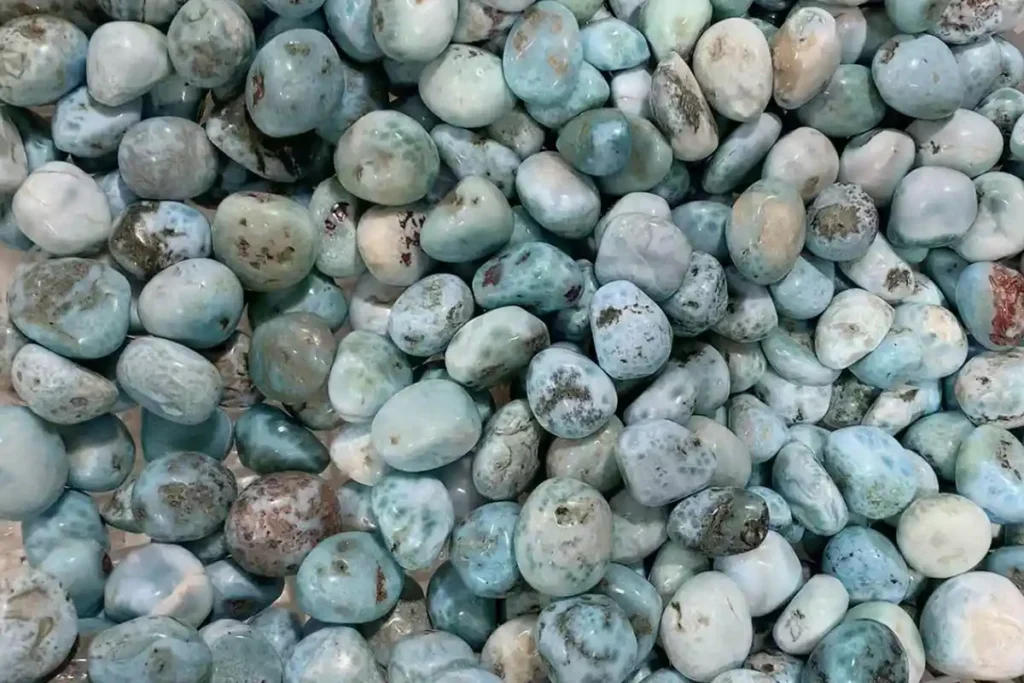 Larimar Stone Benefits reflected in bulk Larimar tumbled stones arranged in a basket