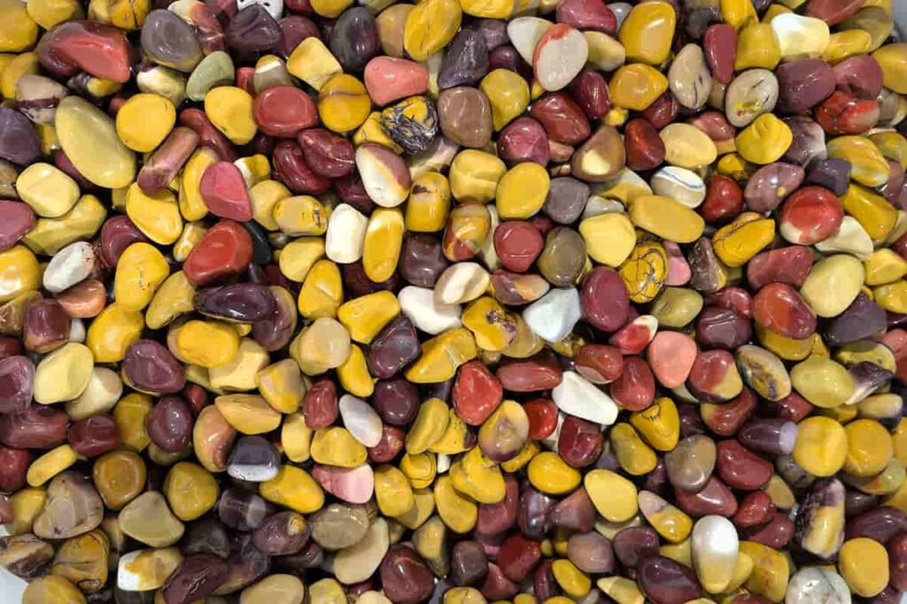 Mookaite meaning chip stones in natural yellow, red, and cream colors