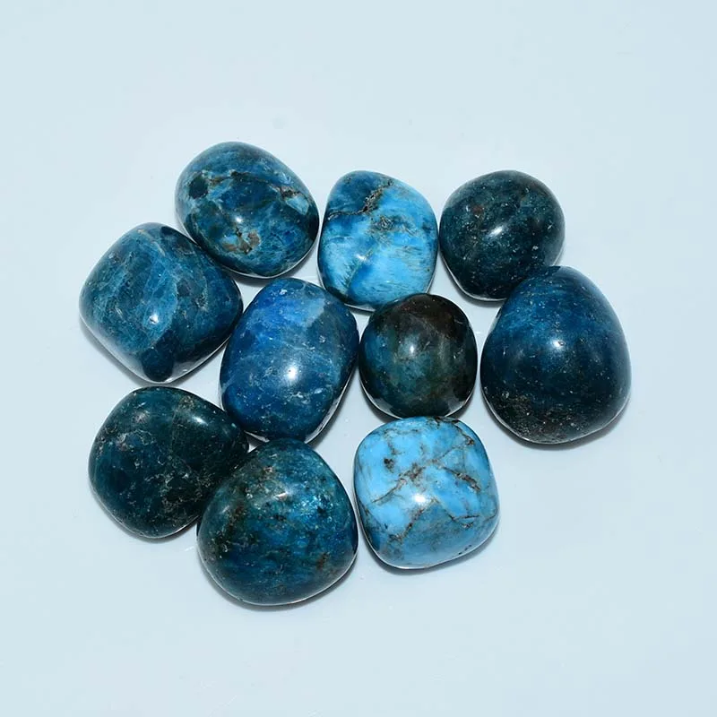 Top view of Blue Apatite Tumbled Stone Wholesale with bright blue natural patterns