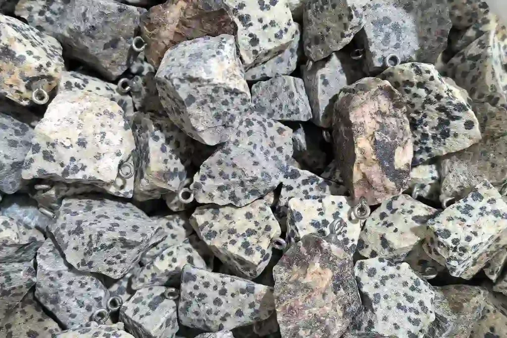 Dalmatian Jasper rough stone pendant showing raw texture and natural Dalmatian Jasper Meaning appeal