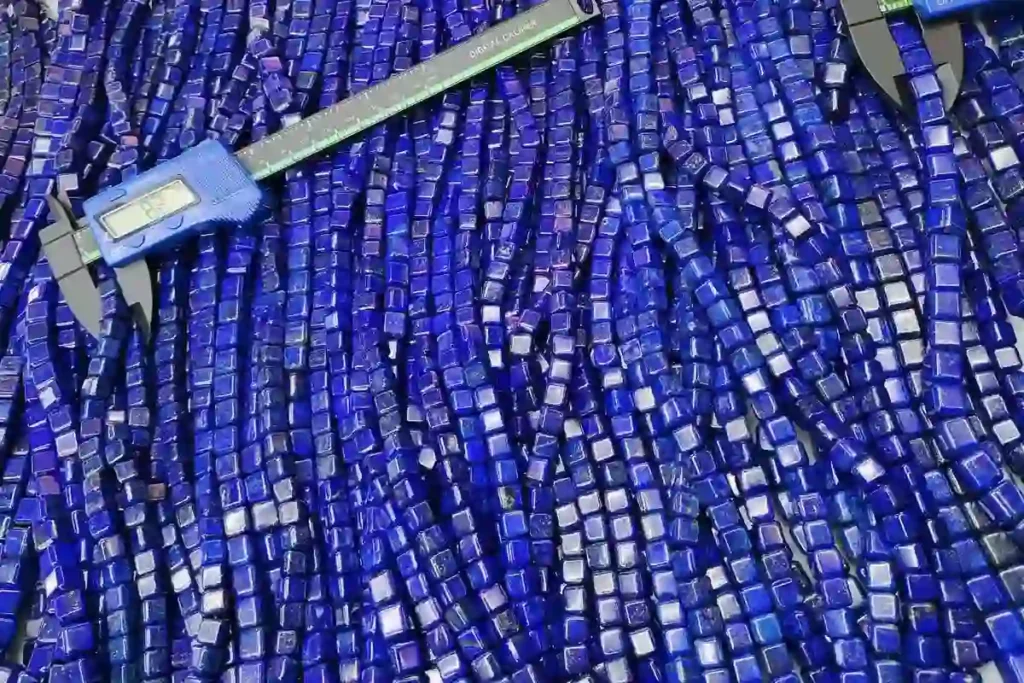 B2B bulk supply illustrating what does lapis lazuli look like when cut into square crystal beads measured by factory calipers.
