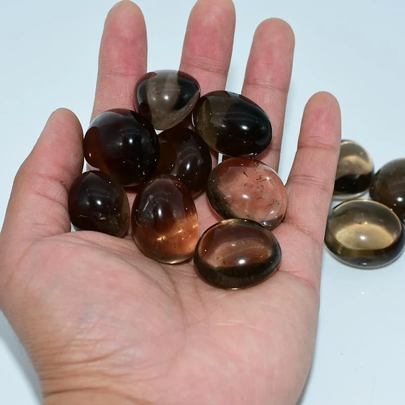 Smoky Quartz Tumbled Stone Wholesale hand display showing size reference and polished finish