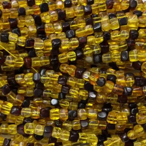 Textured natural square amber strand beads showing organic inclusions and rich colors.