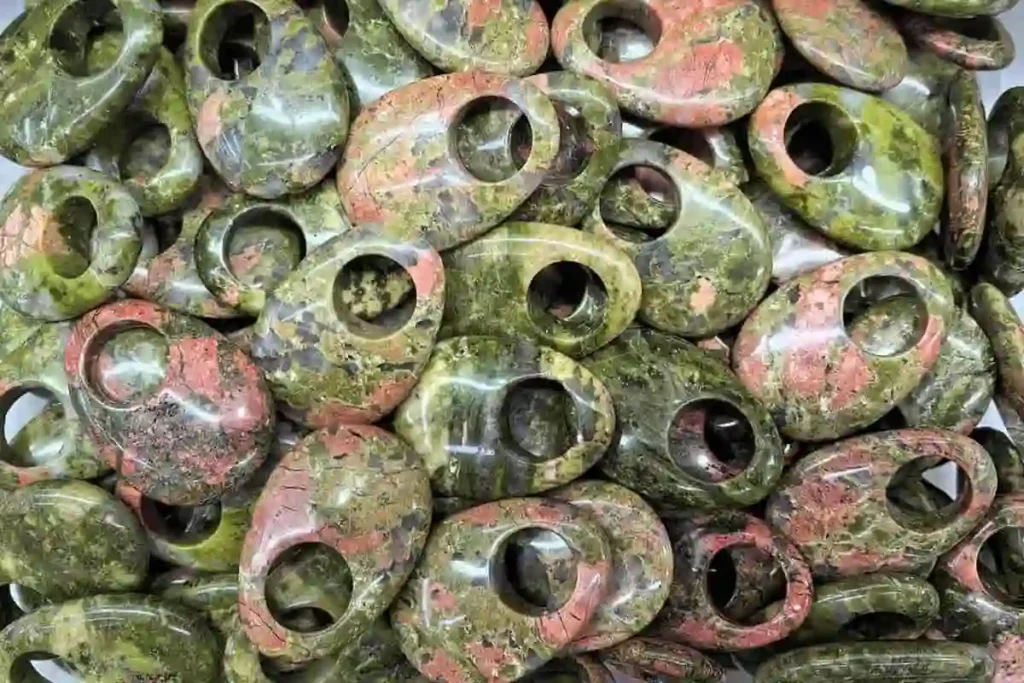 Wholesale Unakite pendant collection featuring green and pink patterns that reflect the spiritual Unakite meaning.