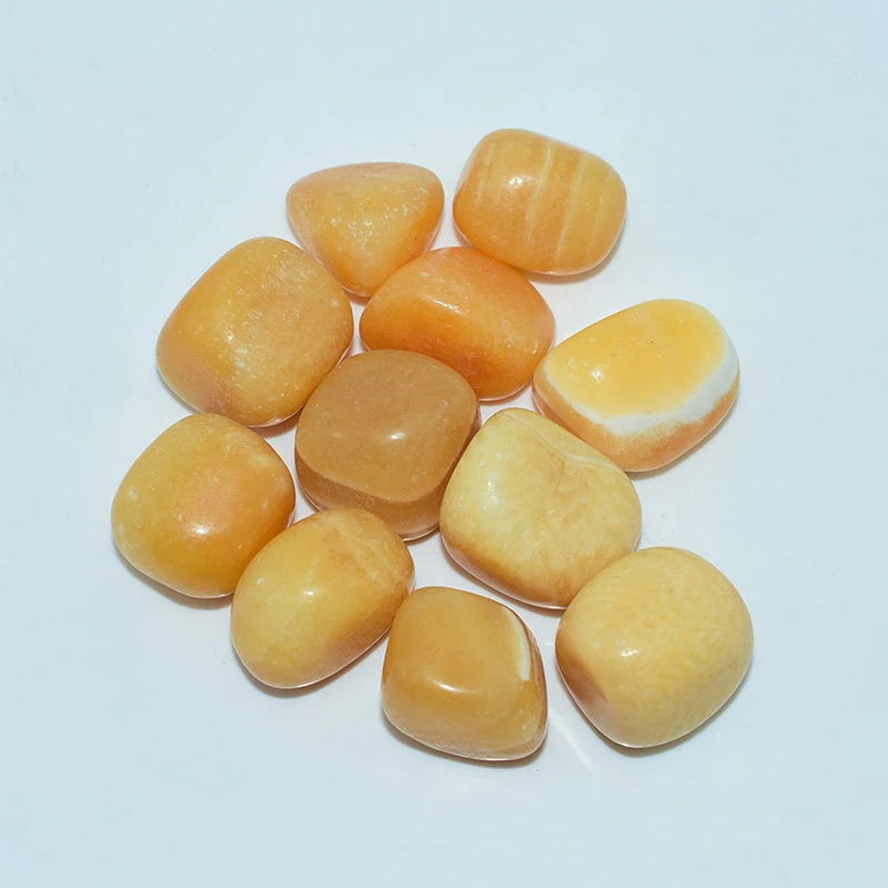 Yellow Calcite Tumbled Stone Wholesale top view with natural yellow patterns