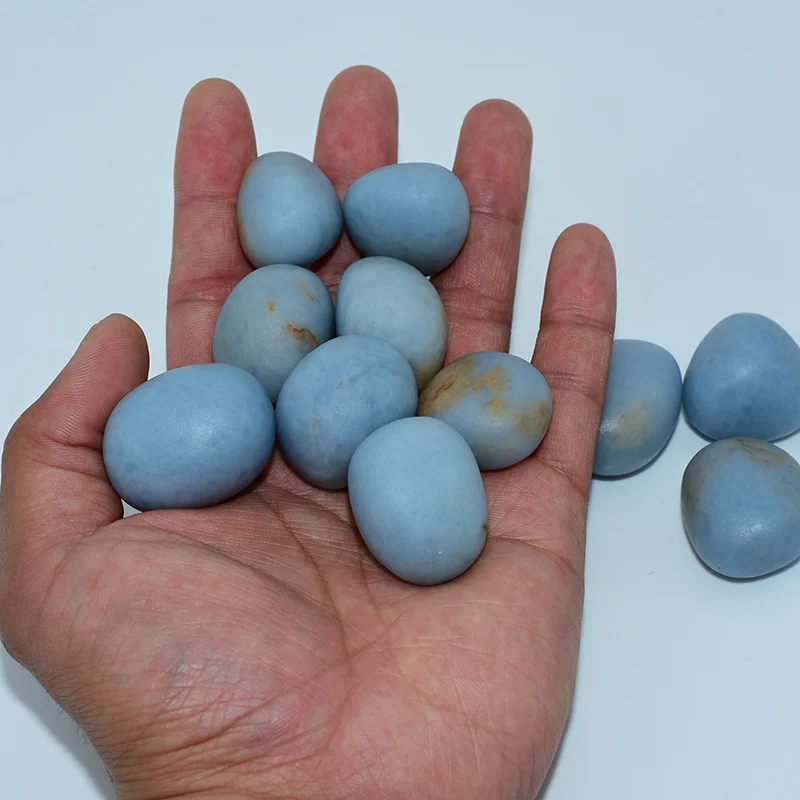 Angelite Tumbled Stone Wholesale showing size comparison in hand for wholesale buyers