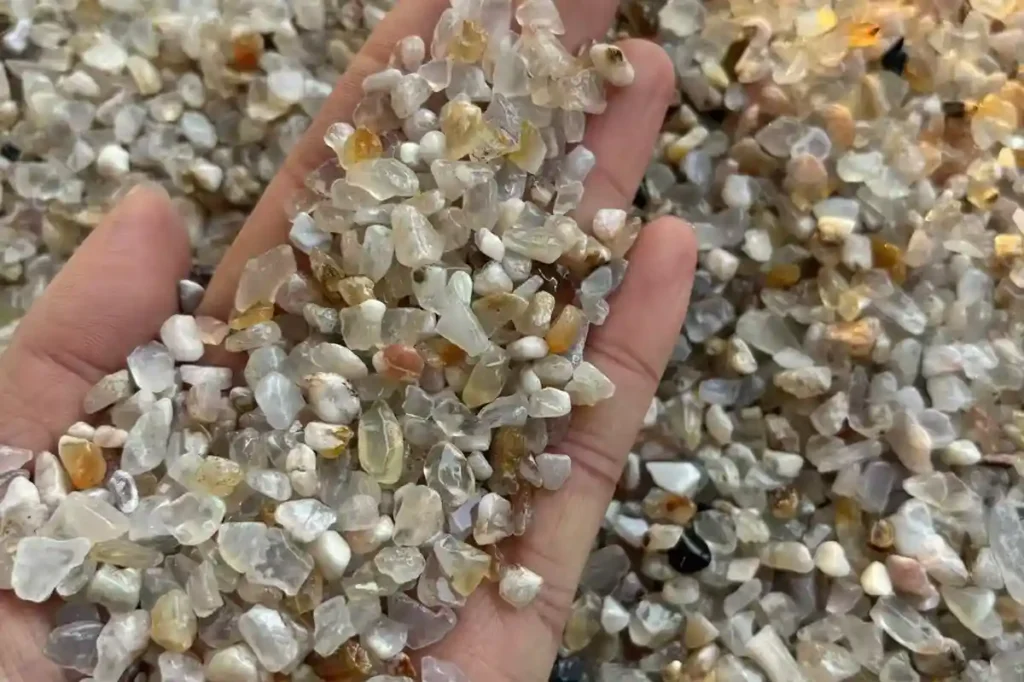 Flower Agate Meaning – 5–7mm natural Flower Agate chip stones displayed in hand