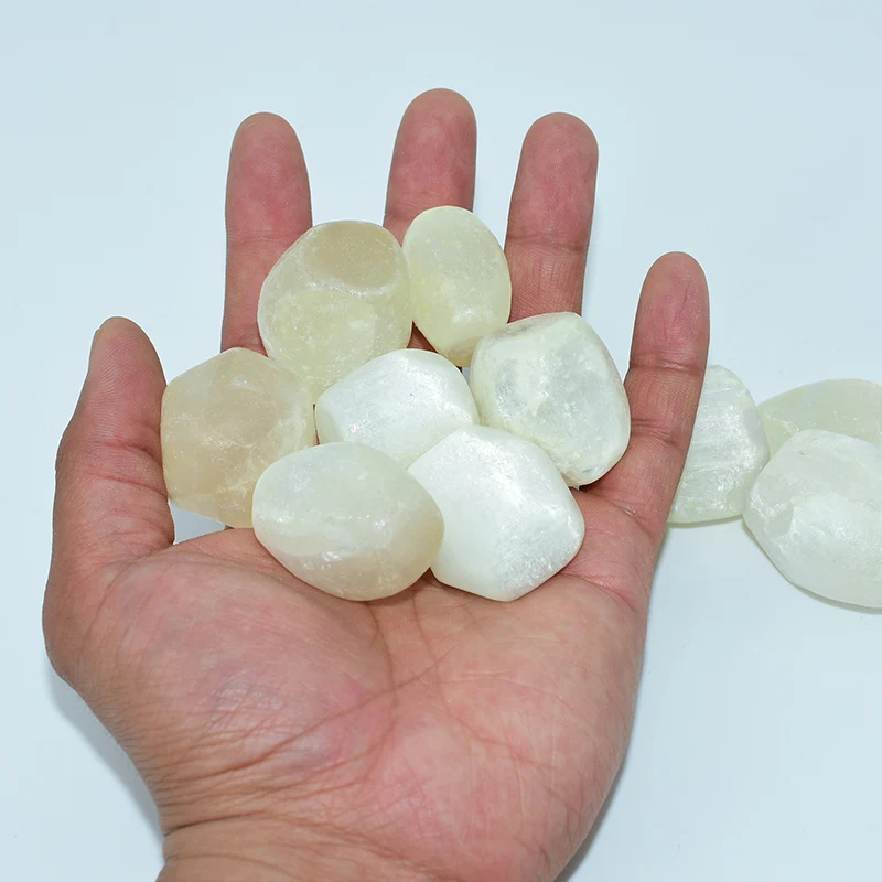 Tumbled Selenite Wholesale bulk stones displayed in a hand