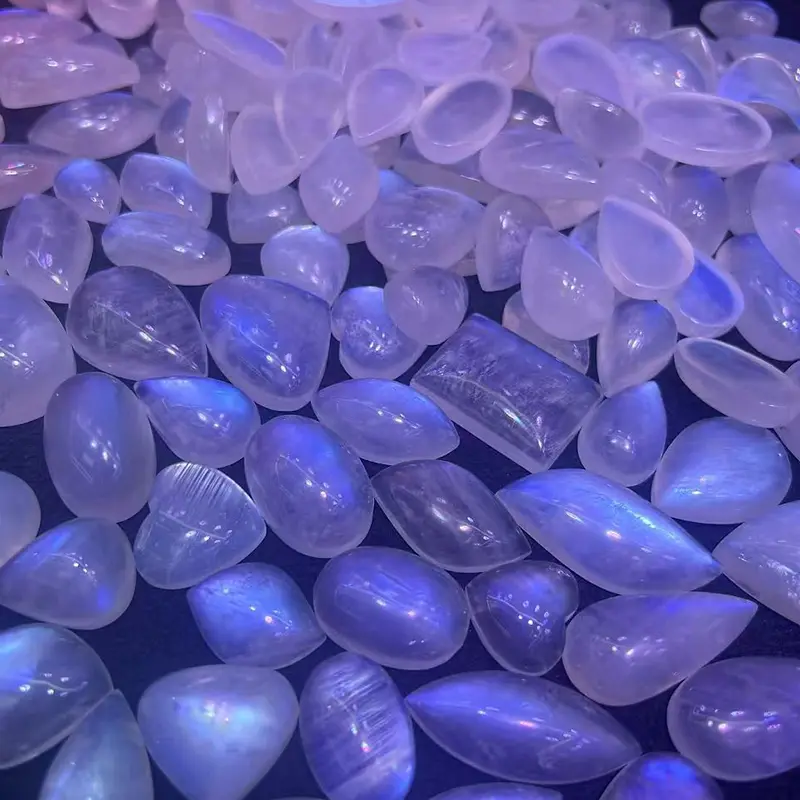 Polished moonstone pendants with blue and purple tones, highlighting Moonstone Benefits for wholesale jewelry designs