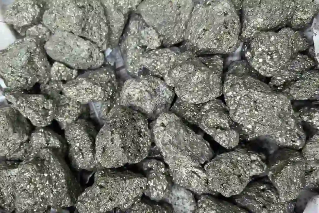 Natural rough pyrite stones with metallic surfaces for Pyrite Crystal Meaning