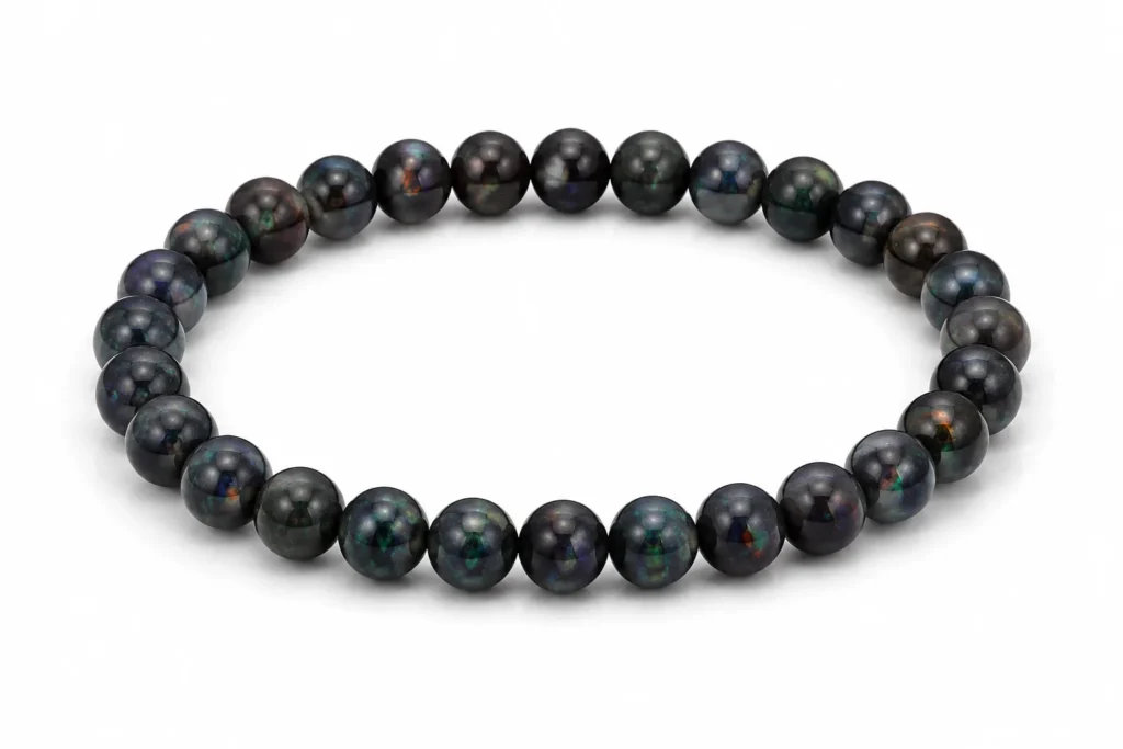 Black Opal Meaning polished bead bracelet on white background