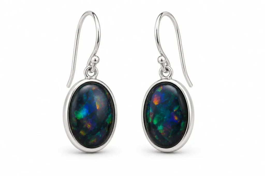 Black Opal Meaning silver drop earrings with oval gemstones