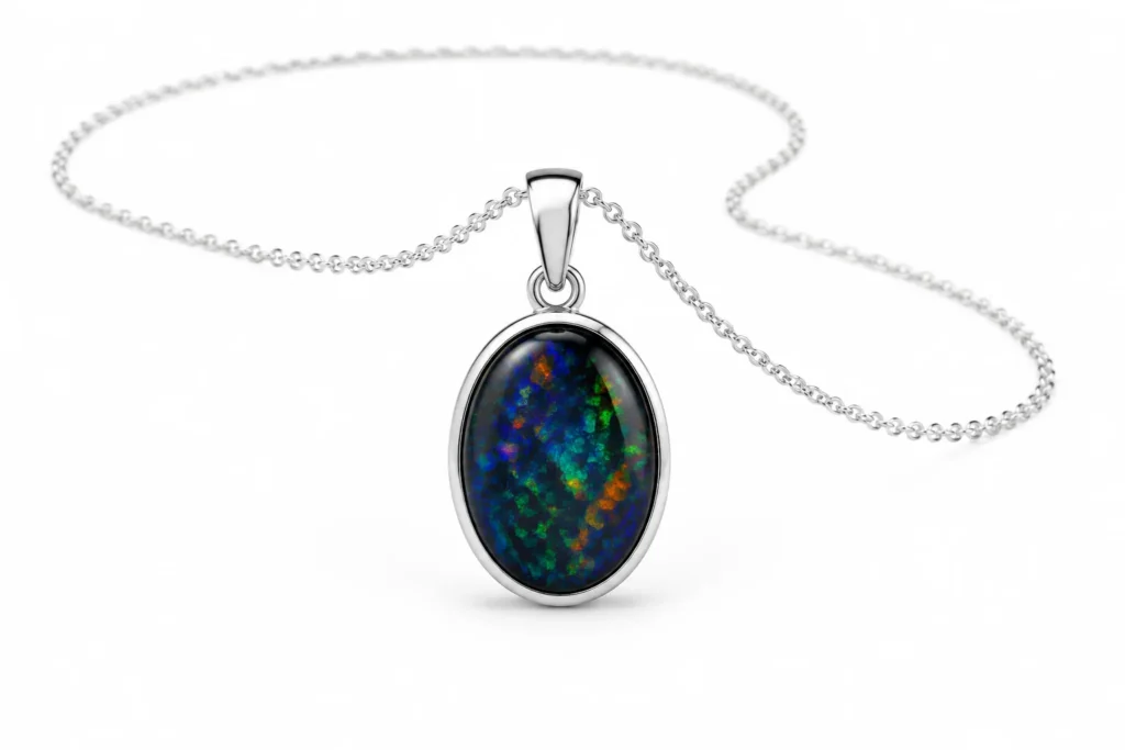 Black Opal Meaning oval pendant necklace in a silver setting