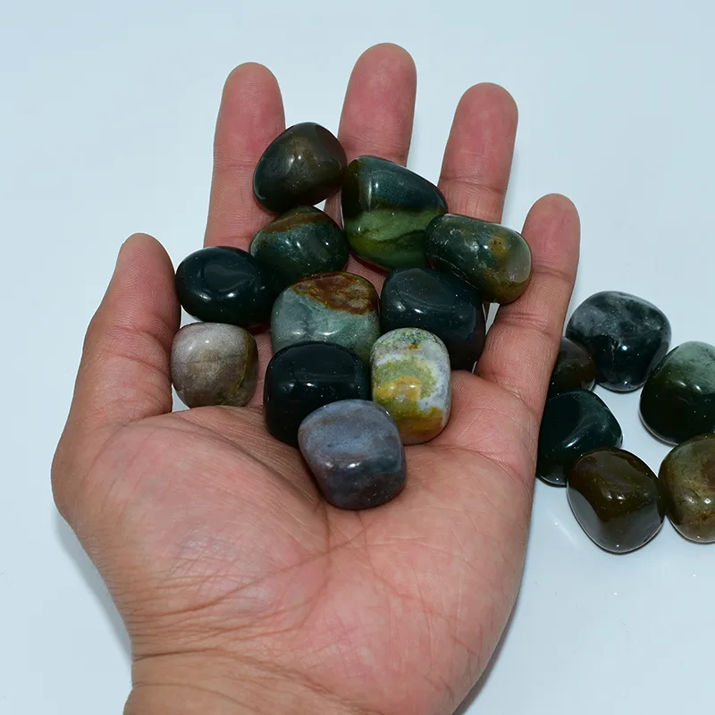 Bulk Indian Agate Tumbled Stone Wholesale displayed by hand to show the natural size and mixed colors