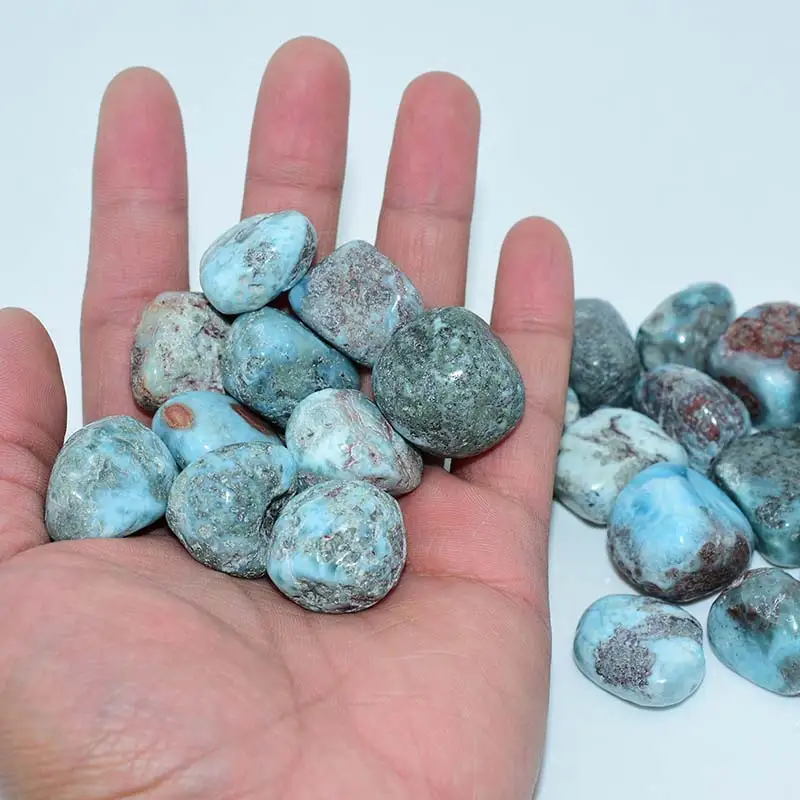 Larimar Tumbled Stone Wholesale bulk stones displayed in hand