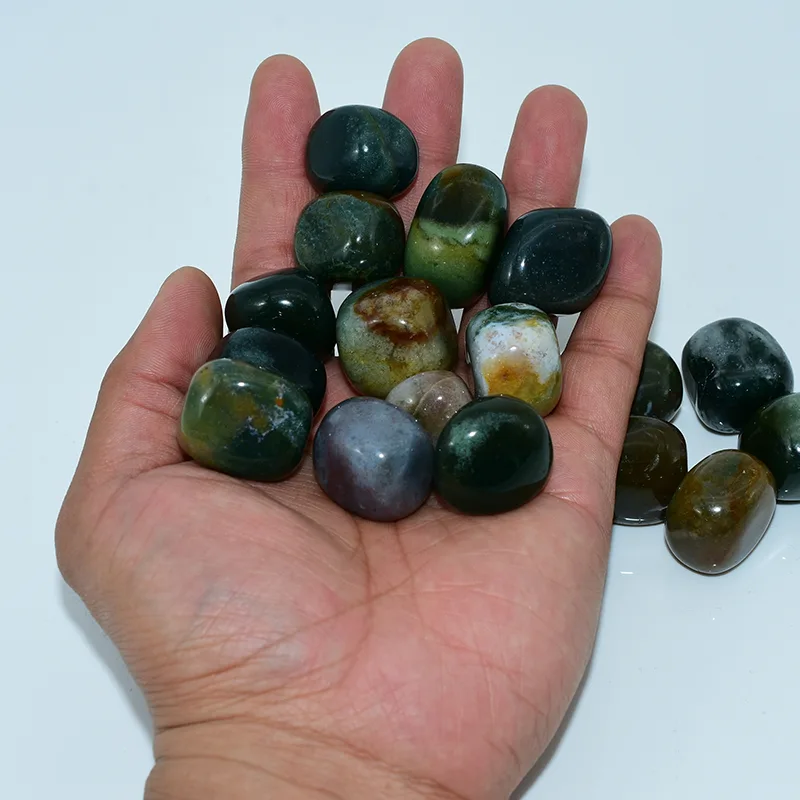 Indian Agate Tumbled Stone Wholesale held in hand for a clear view of the 20–30mm size