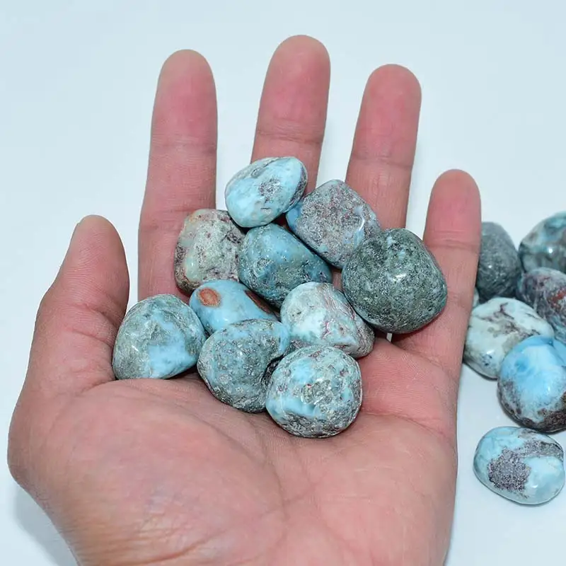 Natural Larimar Tumbled Stone Wholesale size shown on hand