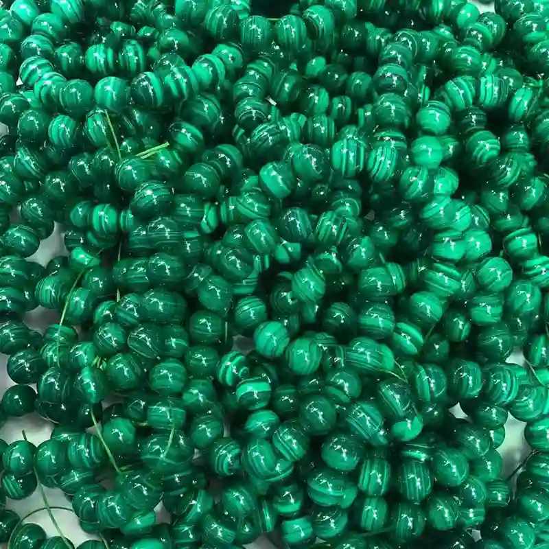 Polished 8mm malachite bead bracelet showing Malachite Benefits and natural patterns