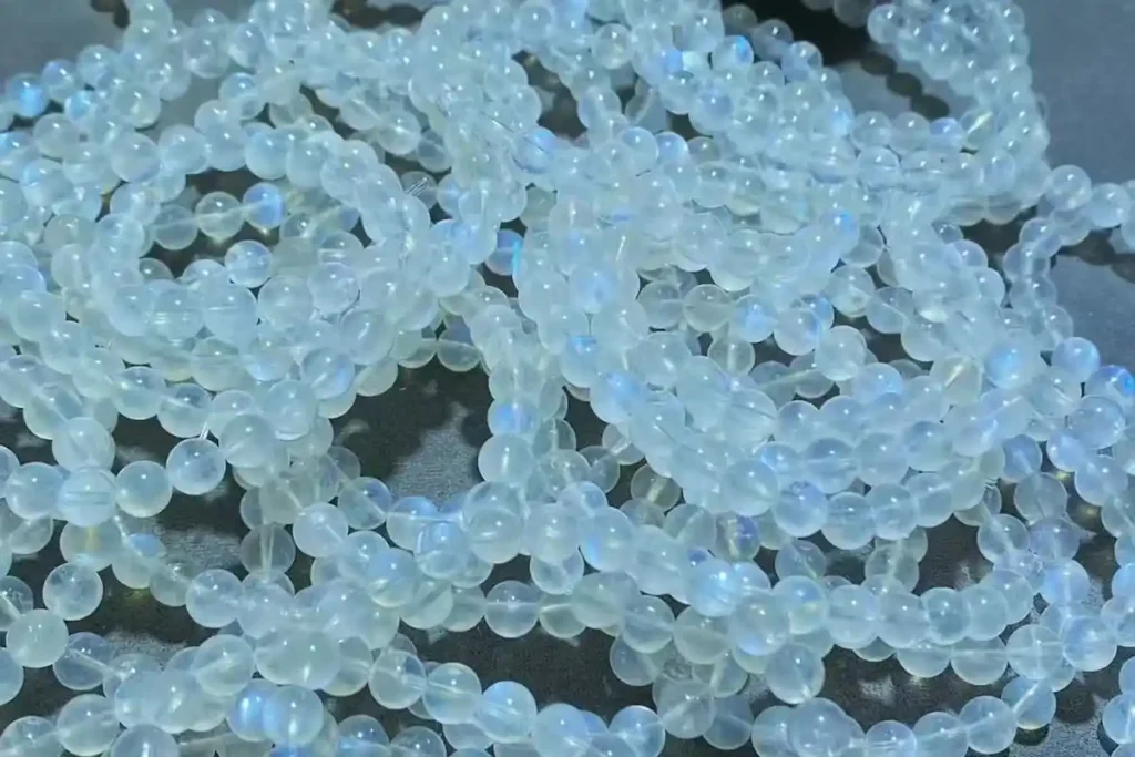 Rainbow Moonstone Benefits bracelet with natural blue flash and semi-transparent stones