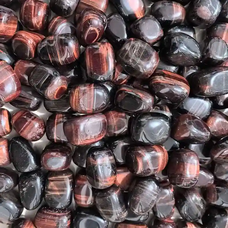 Red tiger eye tumbled stones in 20–30mm sizes showing Red Tigers Eye Meaning