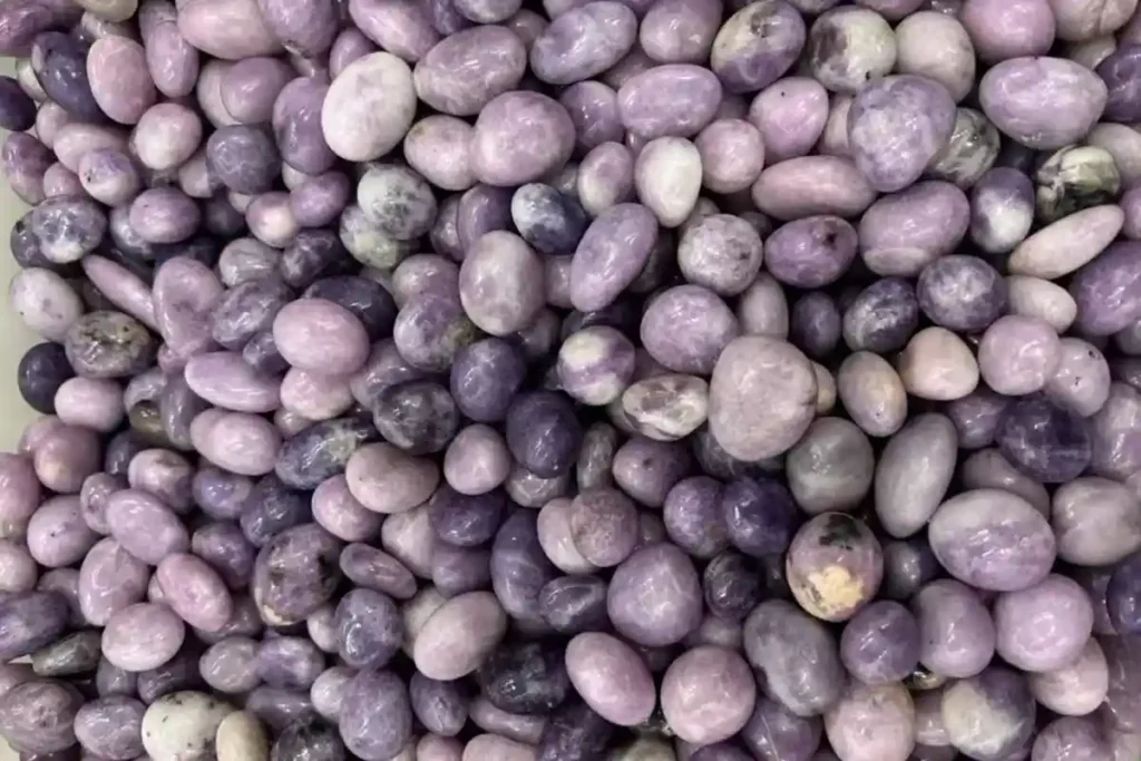 20–30mm purple Lepidolite tumbled stones illustrating natural color variations and Lepidolite Meaning