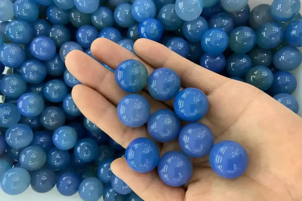 Blue Agate Meaning – hand holding 25 mm blue agate balls