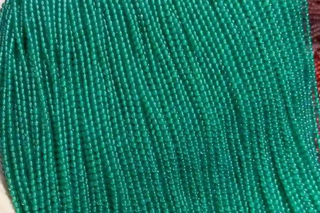 Green Agate Meaning – strands of 2 mm green agate beads