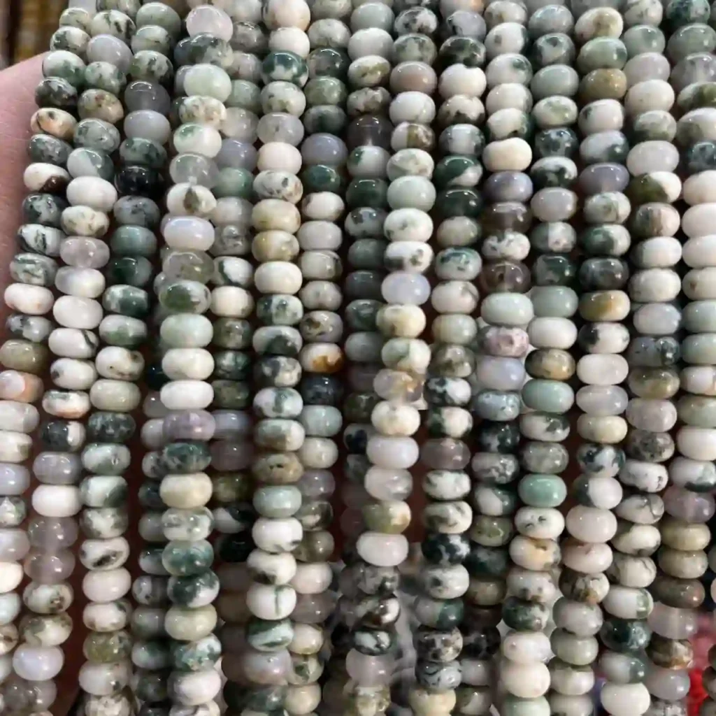 Tree Agate Meaning shown in 4×6 mm rondelle beads with white bases and green branch-like patterns