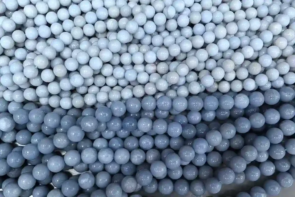 Angelite Stone Meaning featuring wholesale blue Angelite crystal beads in uniform round shapes for jewelry making.