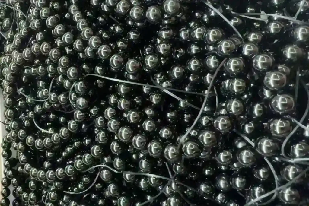 Black Obsidian vs Black Tourmaline guide featuring polished black tourmaline bead bracelets