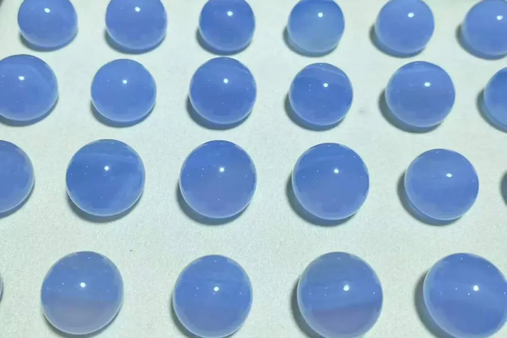 Blue Lace Agate Meaning – polished blue lace agate balls with soft white bands