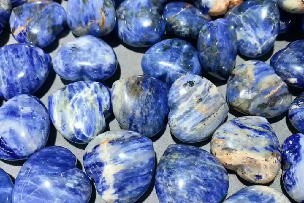 Sodalite Meaning with polished blue sodalite heart-shaped crystals