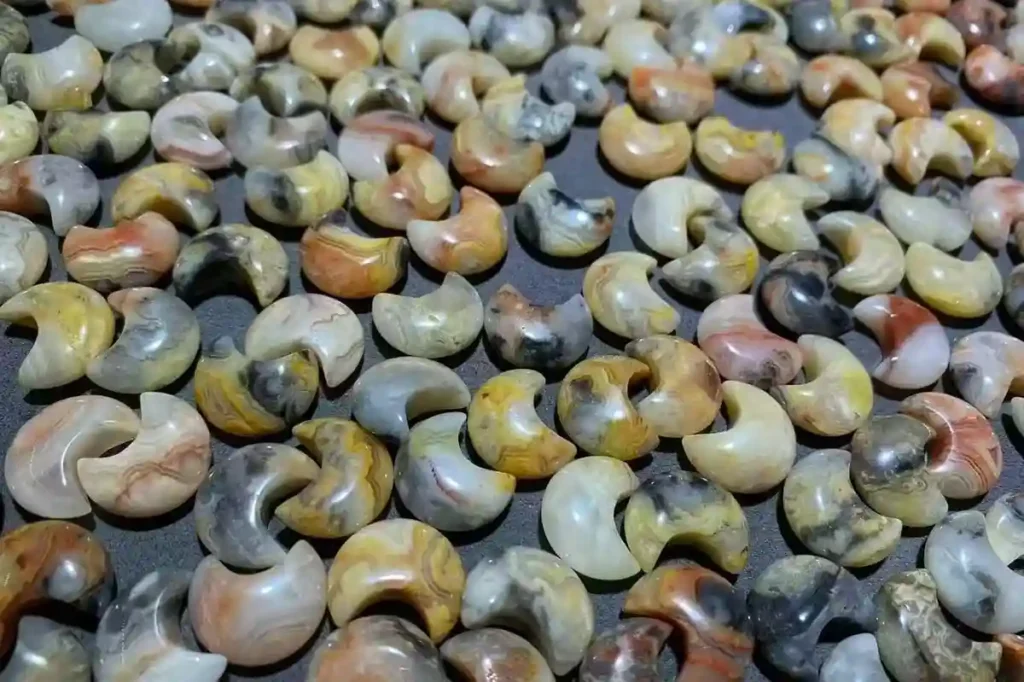 Crazy Lace Agate crescent moon carvings with varied colors and patterns – Crazy Lace Agate meaning