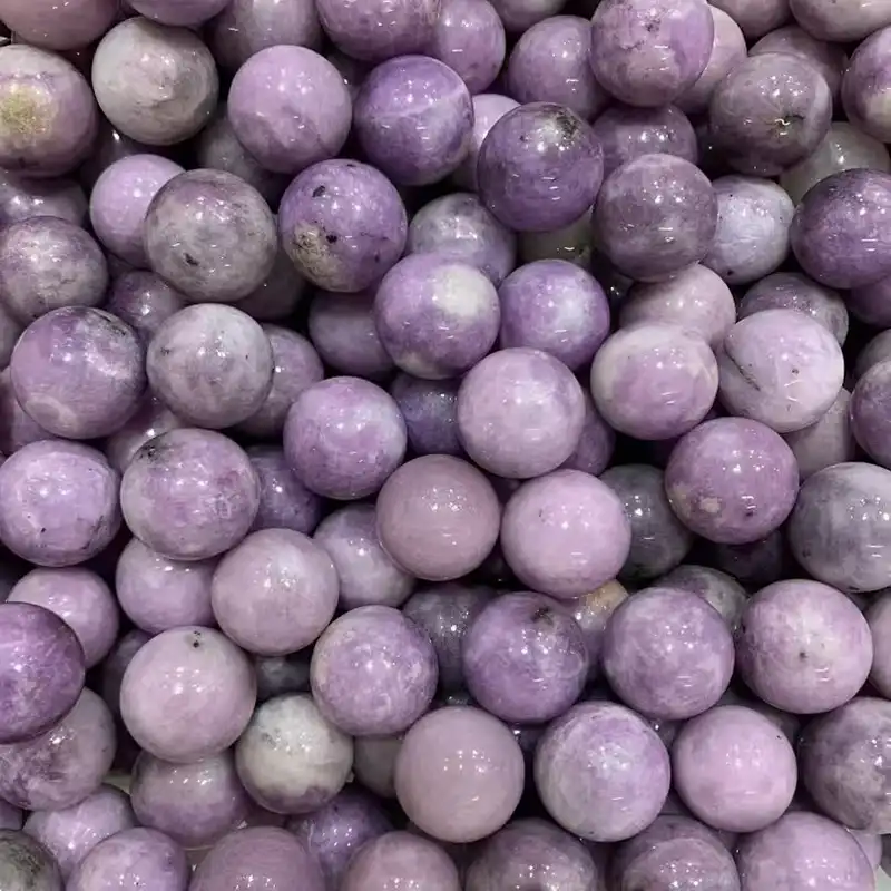 20mm polished Lepidolite sphere with soft lavender tones representing Lepidolite Meaning