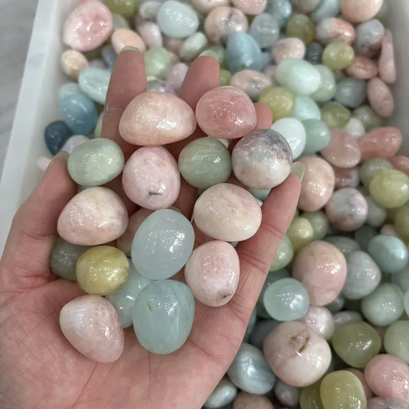 Morganite Tumbled Stone Wholesale pieces displayed in a hand