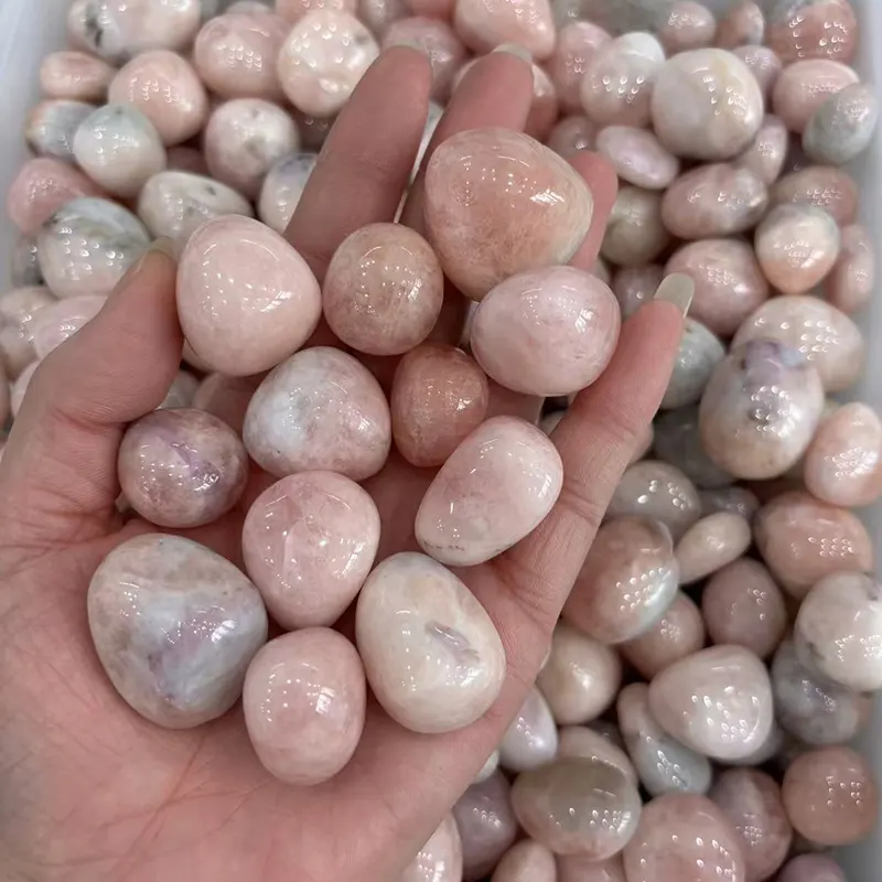 Morganite Tumbled Stone Wholesale pink stones held in a hand