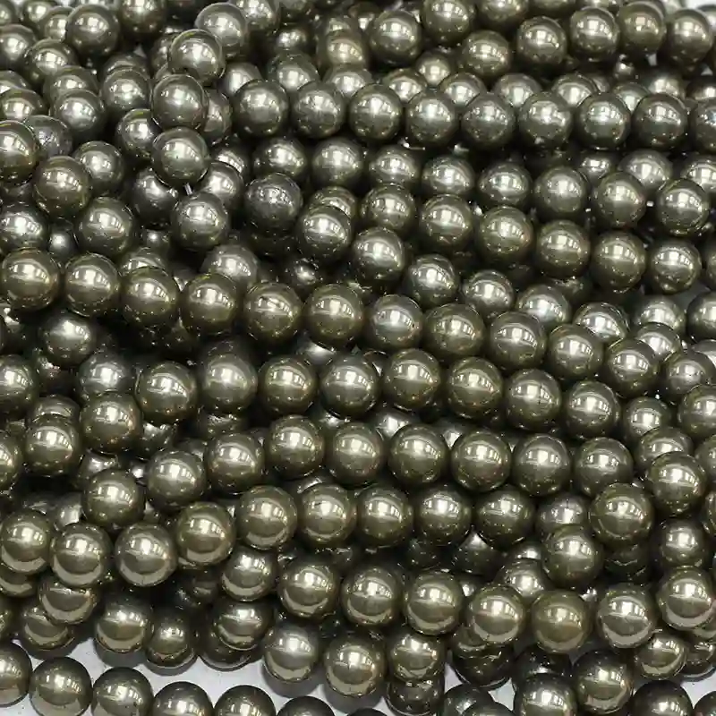 Pyrite Stone Benefits displayed through polished round pyrite string beads