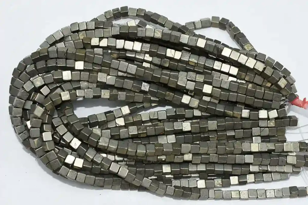Pyrite Stone Benefits featuring square crystal beads for wholesale jewelry designs