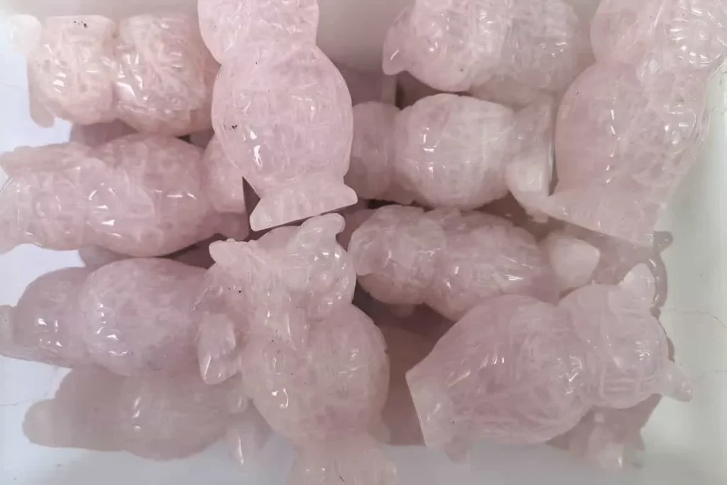 Rose quartz carved owl showing Pink Quartz Meaning and love symbolism