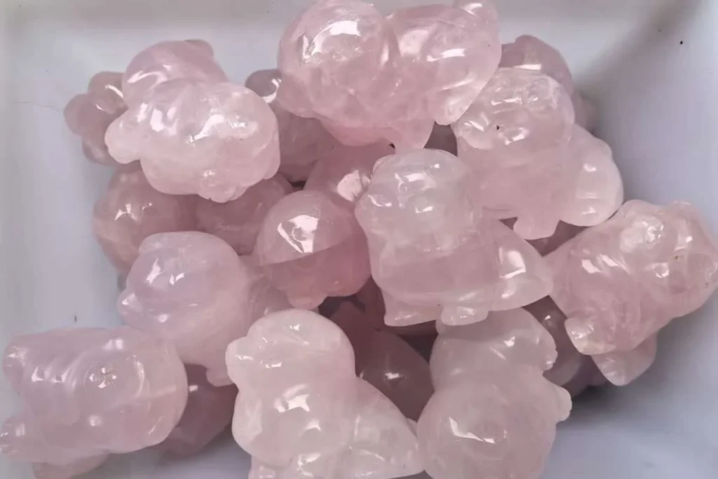 Rose quartz carved pig representing Pink Quartz Meaning and compassion