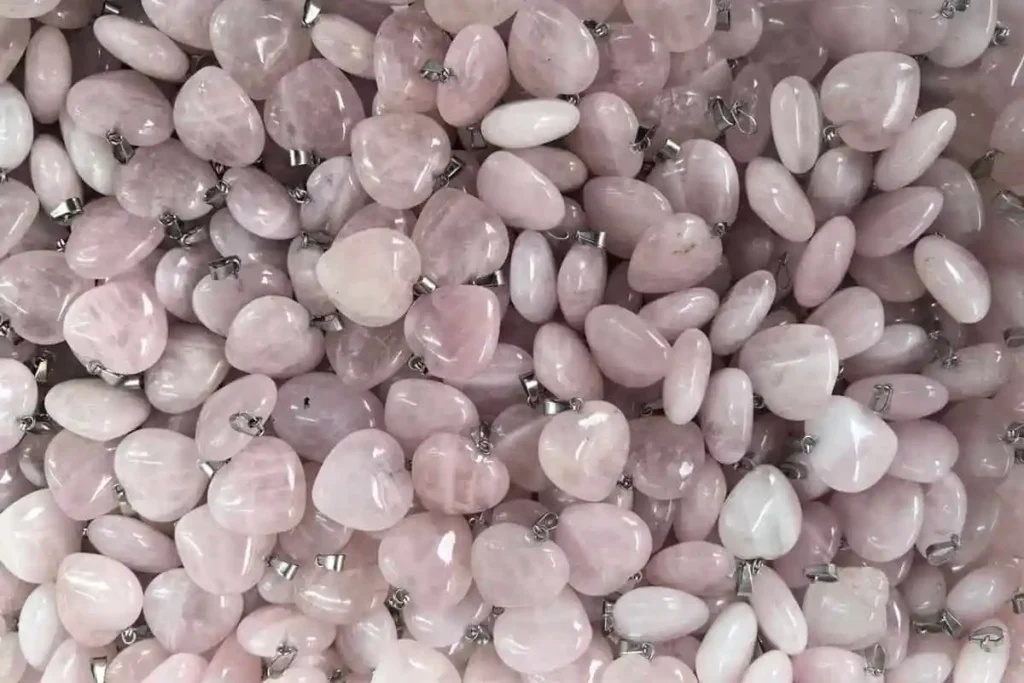 Rose quartz heart pendants associated with Pink Quartz Meaning
