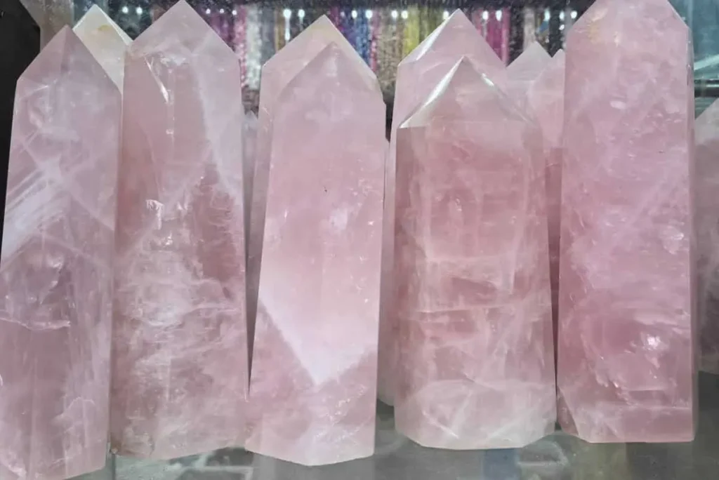 Polished rose quartz towers for Pink Quartz Meaning and crystal displays
