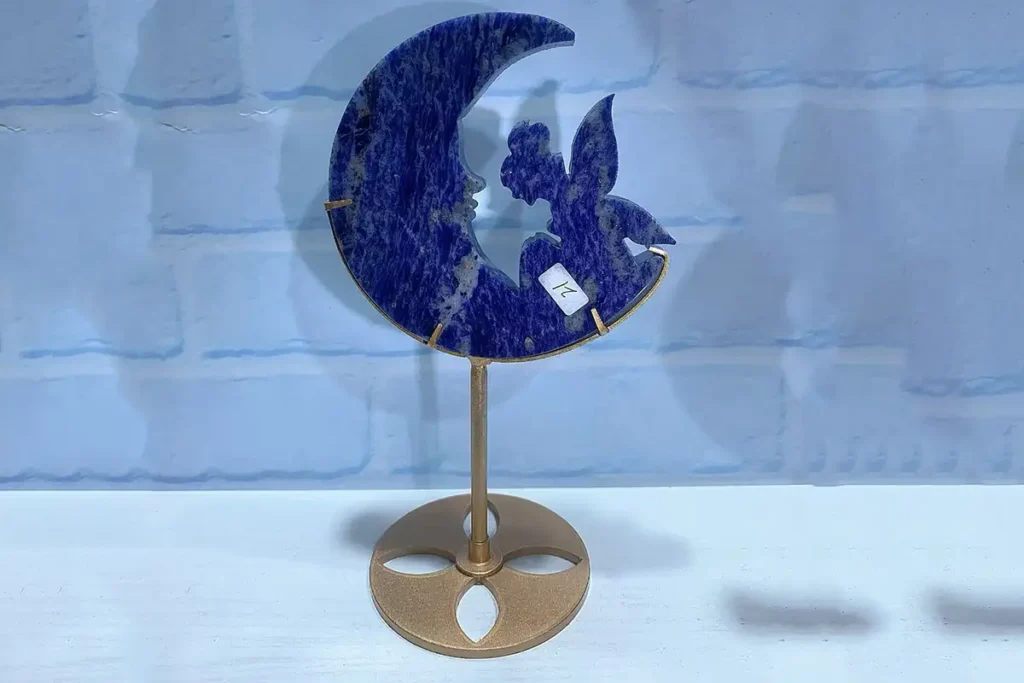 Sodalite Meaning symbolized by a blue sodalite moon crystal stand