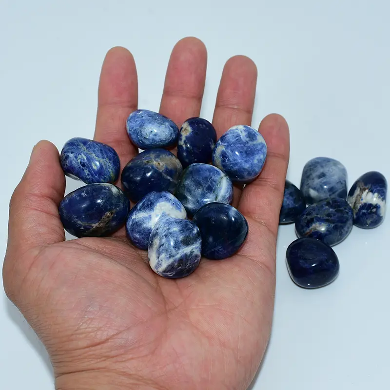 20-30mm Sodalite Tumbled Stone Wholesale held in hand