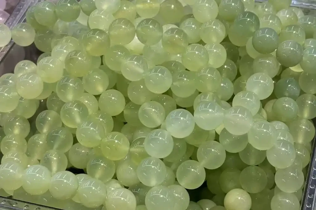 Jade Stone Meaning reflected in polished light green Xiuyu jade bracelets